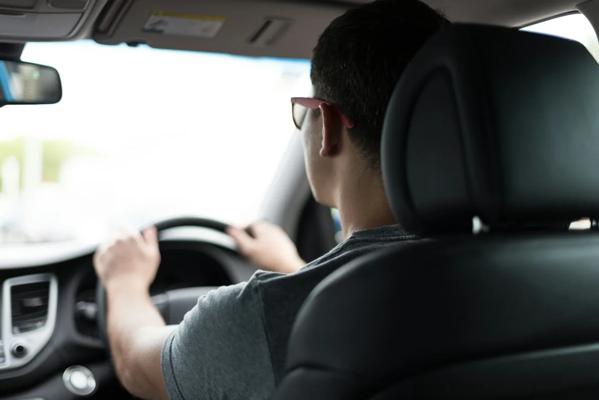 A Maine student at the wheel during a lesson